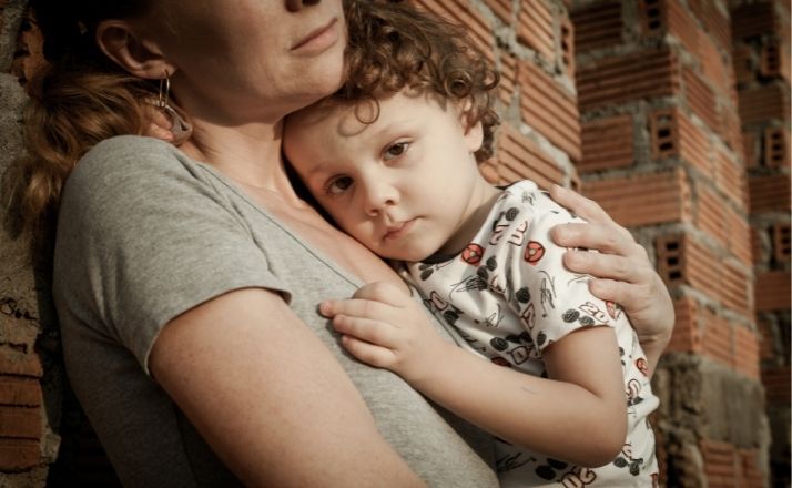 Mom with anxiety holding young son