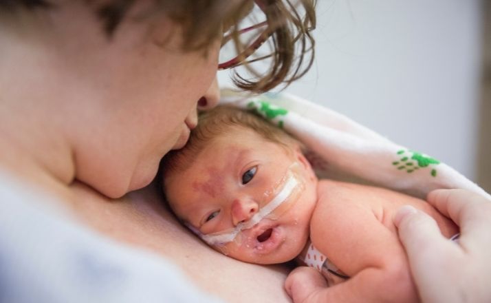 NICU baby held on mommy's chest