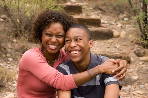 Happy single-mother and teen son