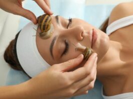 woman getting a snail facial as one of the extreme beauty treatments