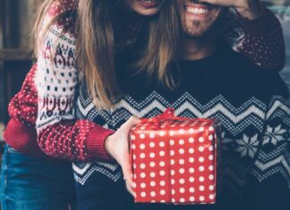 wife surprising husband with a gift after the stress of gift buying for difficult people