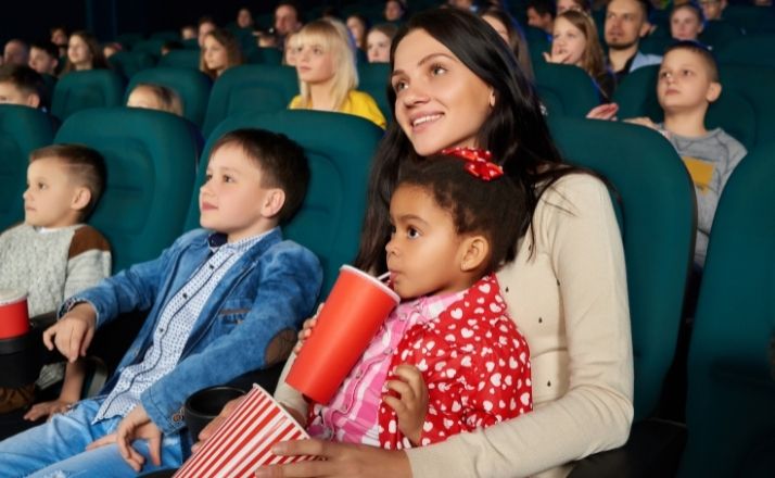 Mom and kids are movies while on a staycation