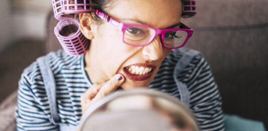 woman's lips in mirror