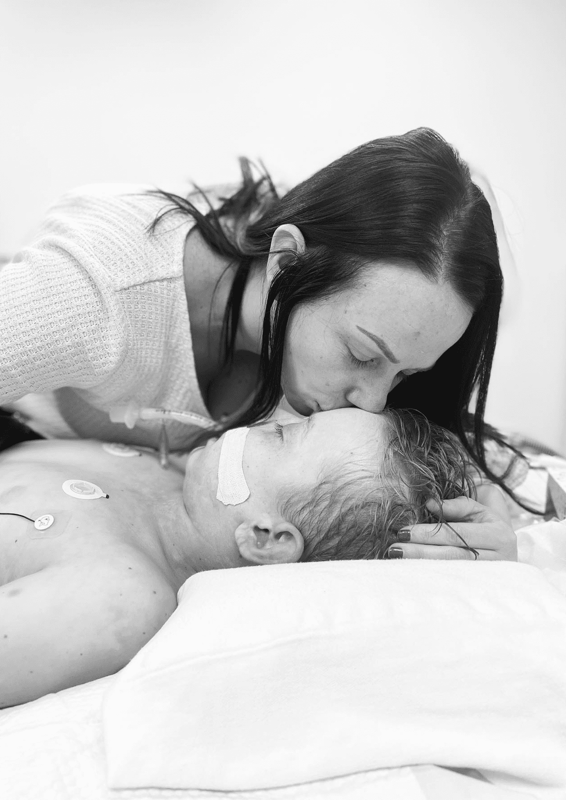 mom kissing head of son as he lay dying in hospital 