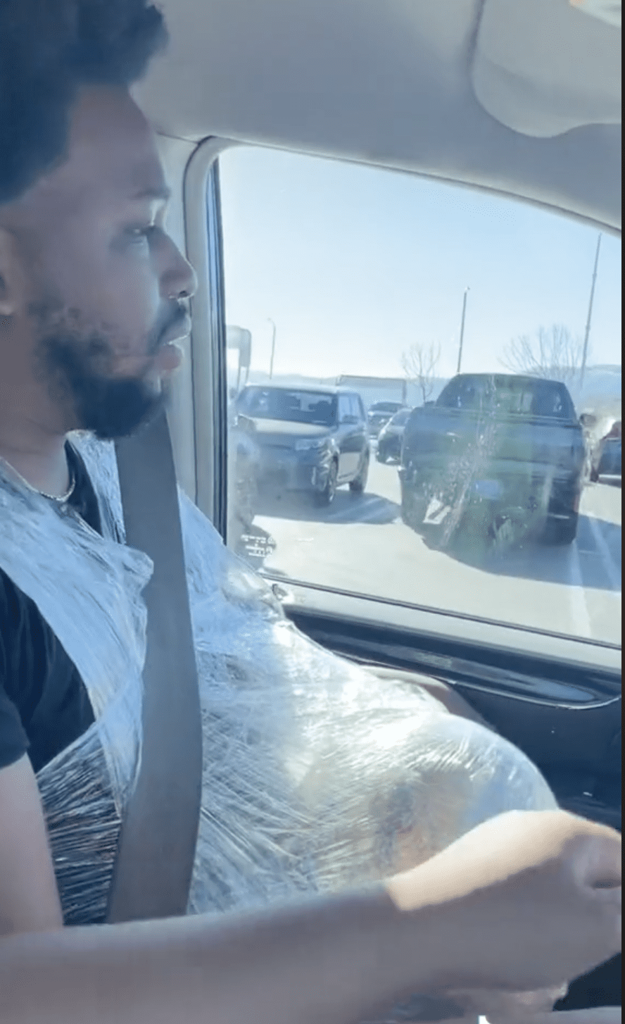 man with watermelon driving