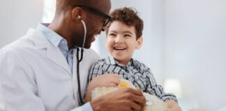 young boy at doctor appointment for developmental milestones