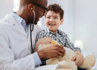 young boy at doctor appointment for developmental milestones