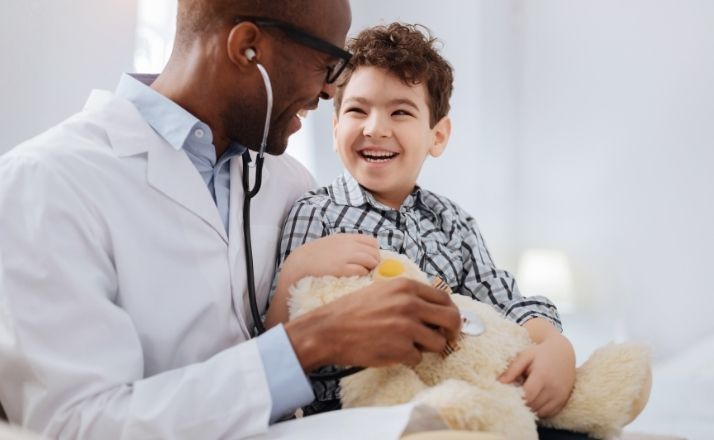 young boy at doctor appointment for developmental milestones