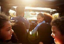 family playing games in the car on a road trip