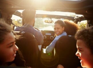 family playing games in the car on a road trip