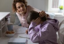 mom consoling stressed daughter as they face family life pressures