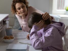 mom consoling stressed daughter as they face family life pressures