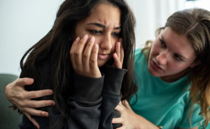 mom trying to console teen daughter who suffers from rejection sensitive dysphoria