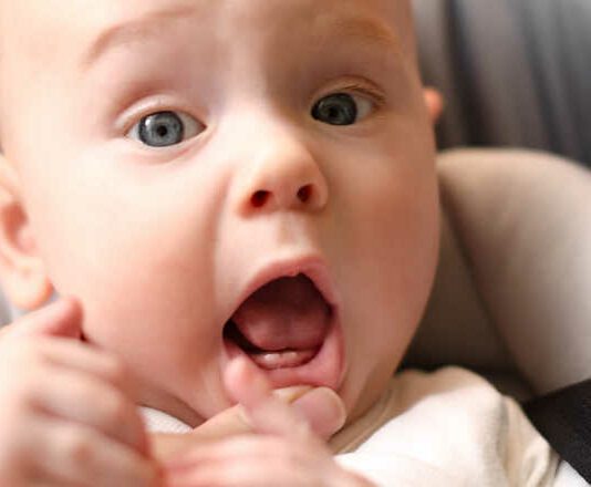 The first babies teeth. The lower front teeth (the lower central incisors). Teething
