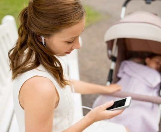 Mom listening to podcast as micro self-care