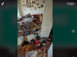 Screenshot of TikTok video by @themessymama4 showing her living room covered in clothing and toys, two children are in the background