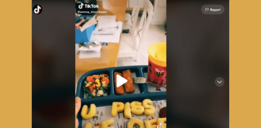 IMage of first frame of TikTok video showing a toddler lunch tray with alphabet letters spelling out "u piss me off."