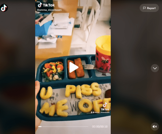 IMage of first frame of TikTok video showing a toddler lunch tray with alphabet letters spelling out "u piss me off."