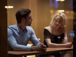 Pretty female flirting with young man at cafe, evening time, pick-up and date