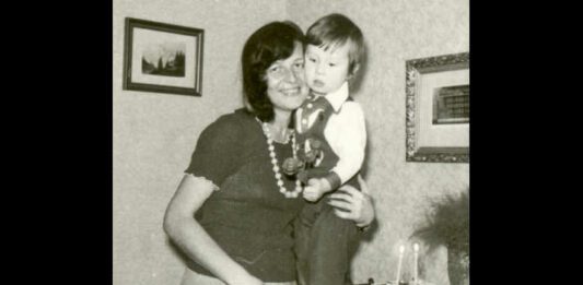 vintage 1975 mom and son standing in dining room