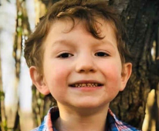 close up photo of six year old boy