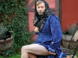 screen shot of man in prairie dress showing his thigh