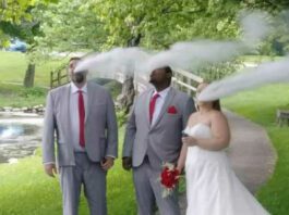 Bride and groom and groomsman vaping in wedding photo