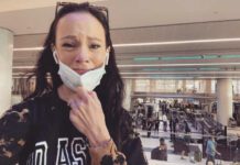 Screenshot of Facebook post woman in airport crying with mask