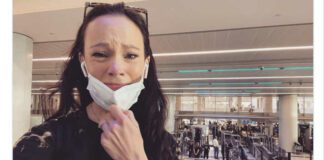 Screenshot of Facebook post woman in airport crying with mask