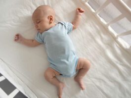 Baby asleep in crib