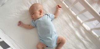 Baby asleep in crib