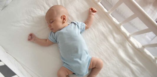 Baby asleep in crib
