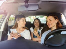 Mom and daughters talking and laughing in their car