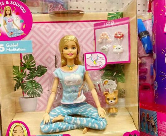 screenshot of photo of yoga barbie in box