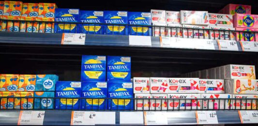 Minsk, Belarus. Mar 2022. Women`s hygiene products on shelf in supermarket. Feminine hygiene products in grocery store. Sanitary protection for women, sanitary napkins and tampons