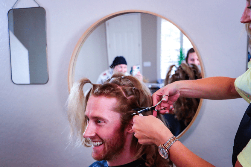 Image of Matt Shaha getting his hair cut. Courtesy of Mercedes Berg Photography