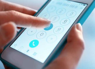 Finger touch number on smartphone to make a call, close up