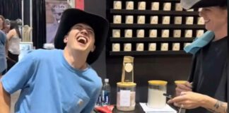 man wincing in pain experiencing period pain simulator