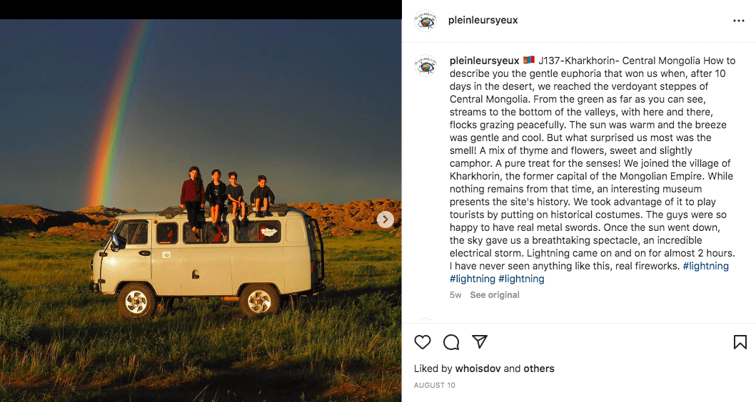 Screenshot of pleinleursyeux Instagram post showing kids sitting on a van in front of a rainbow in Mongolia.